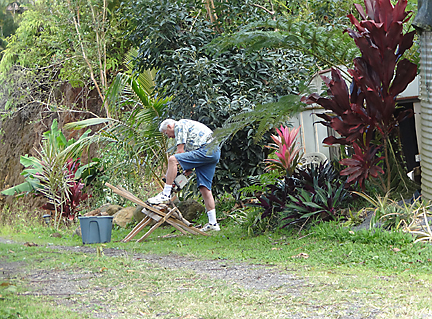 dad cutting logs for the wood stove